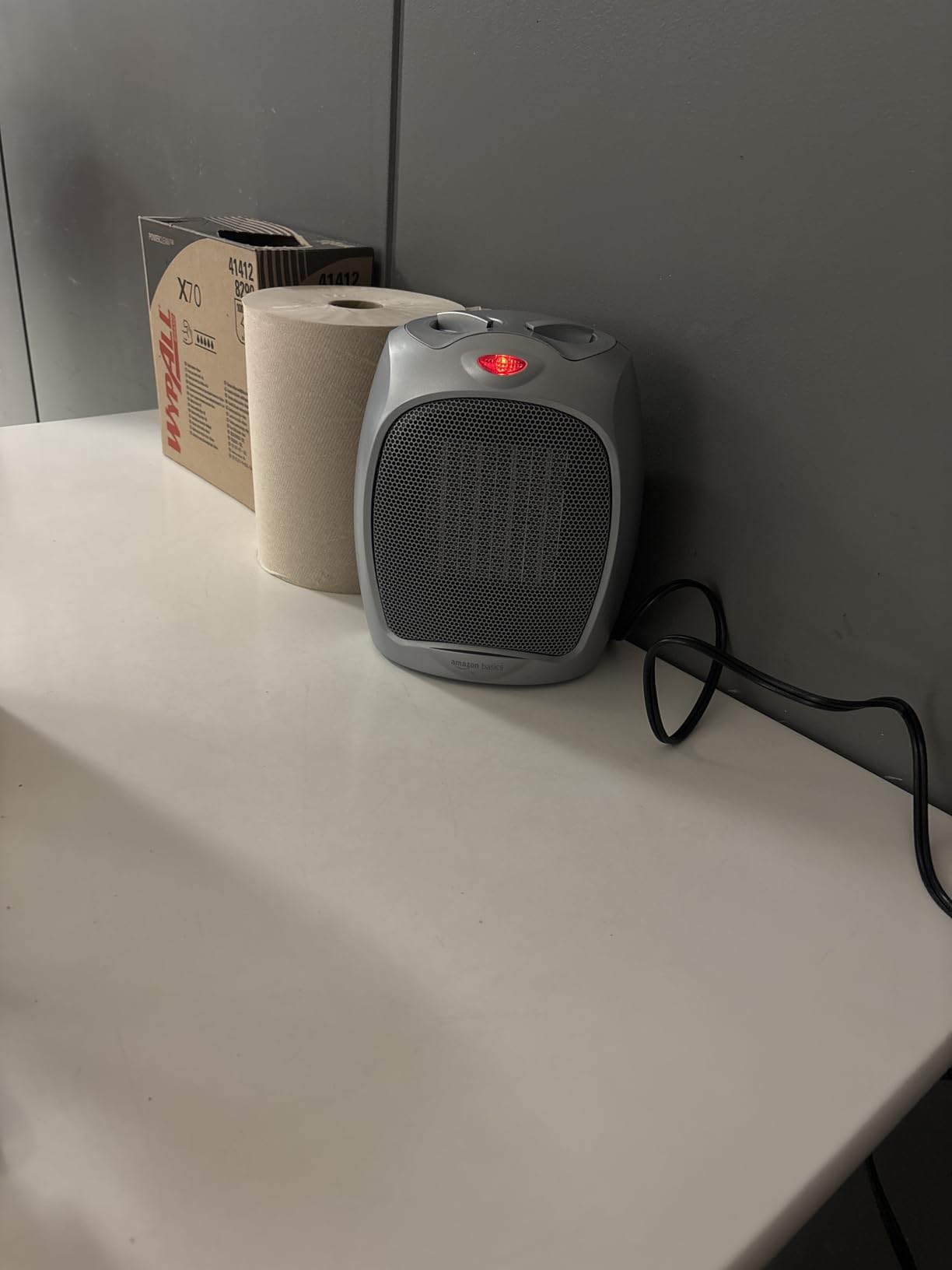 Amazon Basics Ceramic Space Heater, Portable Indoor Heating Solution, With Overheat and Tip-Over Protection, Thermostat, Non-Oscillating, 1500W, Fast Heating, Silver customer photo 1