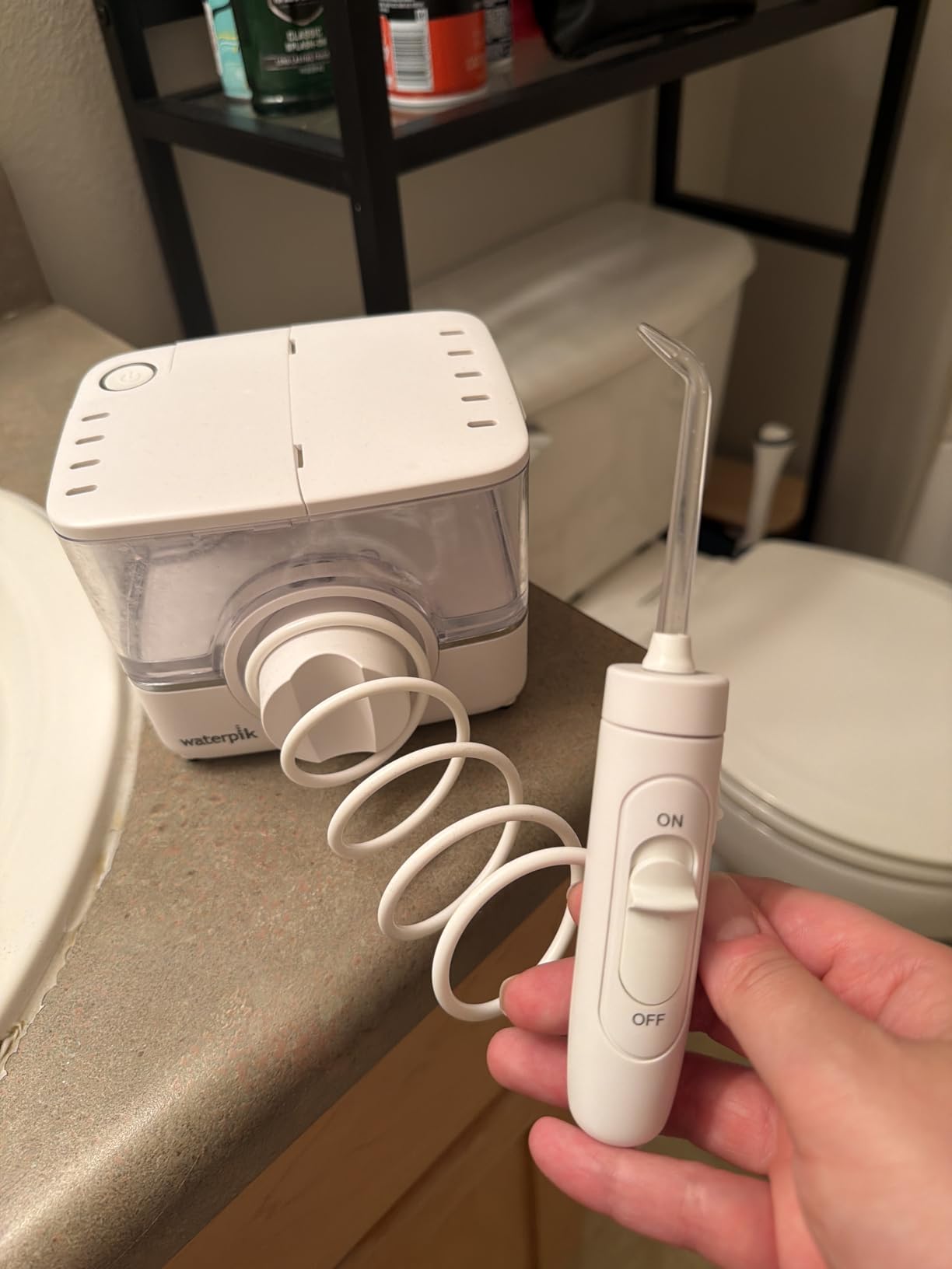 Waterpik ION Rechargeable Water Flosser with 10 Settings, 7 Tips, Black - Portable Cordless Countertop for Daily Gum Health, Braces, Implants, ADA Accepted, WF-12 customer photo 1