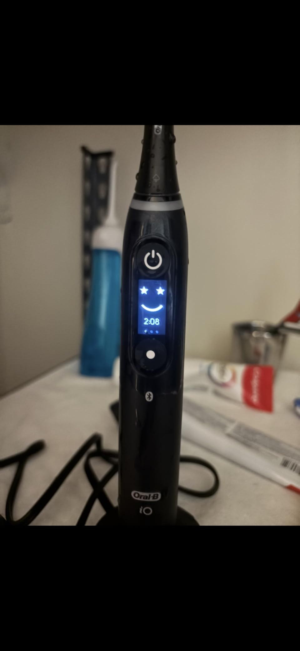 Oral-B iO Deep Clean + Protect Rechargeable Electric Toothbrush, Black, iO Series 7, 2 Replacement Brush Heads, Charging Travel Case (package may vary) customer photo 2
