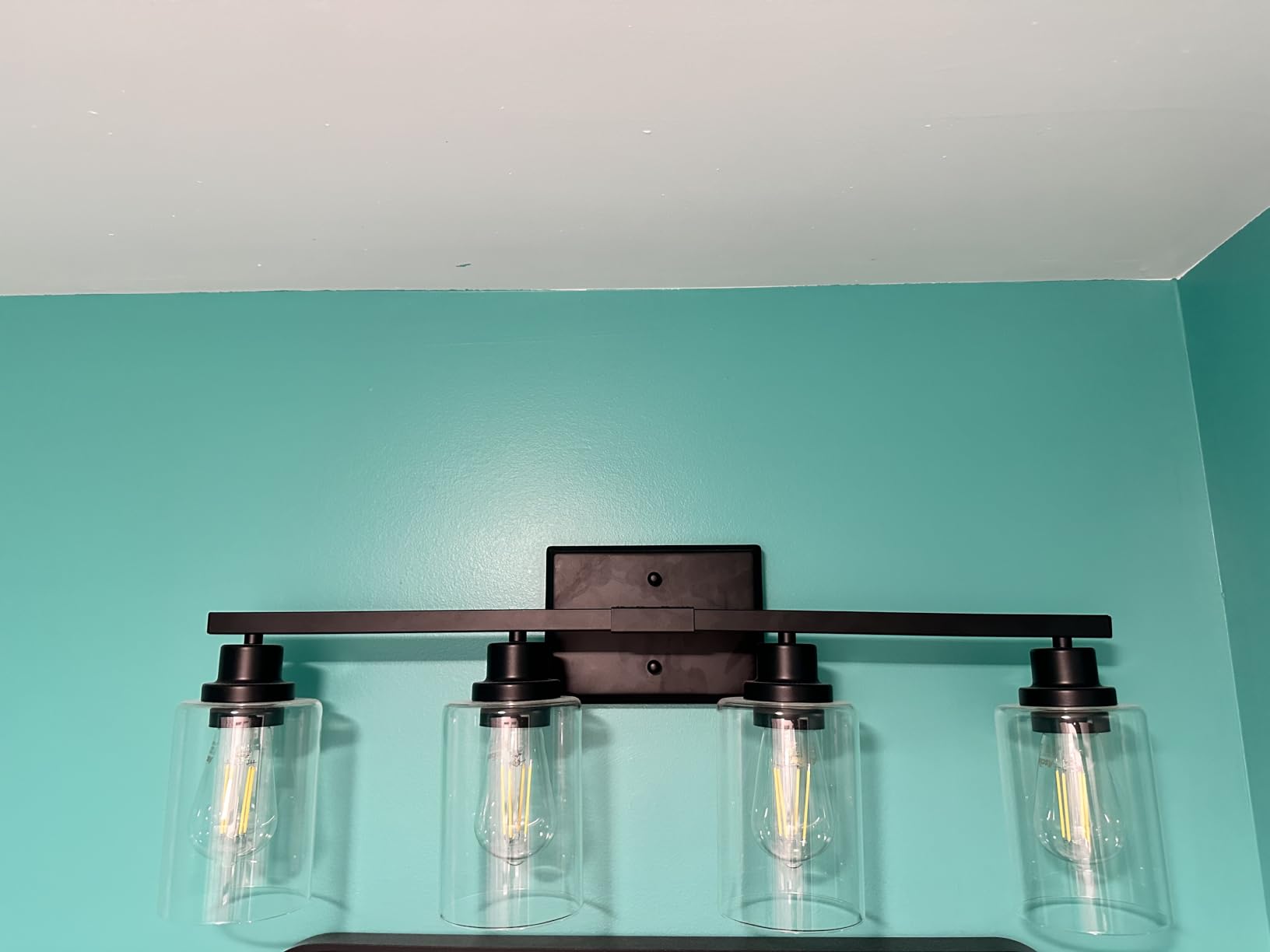 Unicozin Modern Bathroom Light Fixtures, 4 Light Vanity Lights Over Mirror, Black Wall Lamp with Clear Glass for Living Room Cabinet Bedroom Porch customer photo 1