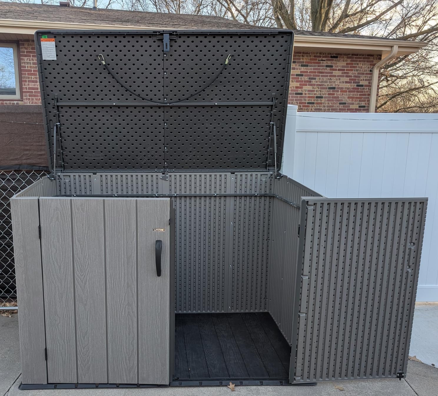 LIFETIME Horizontal Outdoor Storage Shed, Weather Resistant Resin Storage Can Fit Two Large Garbage Cans, Lockable Doors, Spring‑Hinge Lid, Low‑Maintenance Backyard Utility Shed customer photo 1